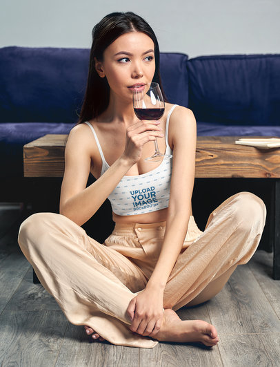 Crop Top Mockup Featuring a Woman Drinking From a Glass of Red Wine