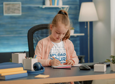 Round-Neck Tee Mockup of a Little Girl Drawing on a Coloring Book m25898-r-el2