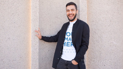 Young Man Wearin a Round Neck Tee Stop Motion Near a Concrete Wall