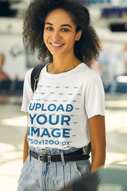 Round-Neck Tee Mockup of a Smiling Woman at an Airport Departure Lounge m17689-r-el2