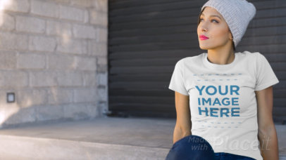 Woman Wearing a T-Shirt Video Sitting Outside a Closed Store Mockup