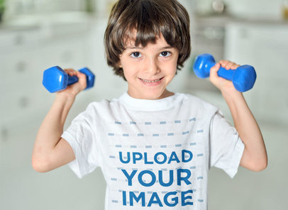 T-Shirt Mockup Featuring a Happy Little Boy Carrying Weights