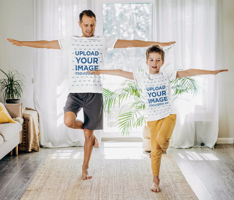 T-Shirt Mockup Featuring a Man Doing Yoga With His Son at Home