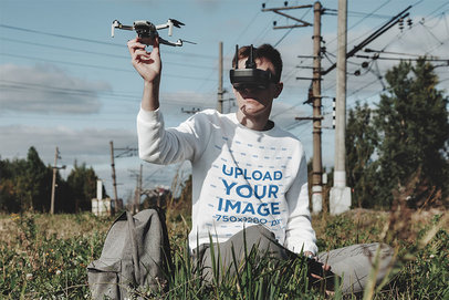 Sweatshirt Mockup of a Man Flying a Drone With a VR Set m19628-r-el2