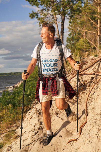 Round-Neck Tee Mockup Featuring a Happy Man Hiking