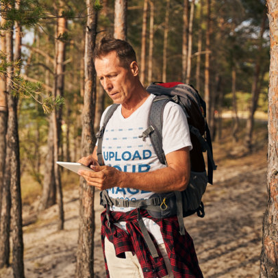 T-Shirt Mockup of an Experienced Hiker with a Backpack 