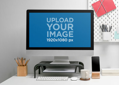 Mockup of an iMac Placed on a Minimalistic-Themed Desk