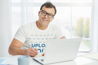 T-Shirt Mockup of a Man Smiling While Working m12957-r-el2