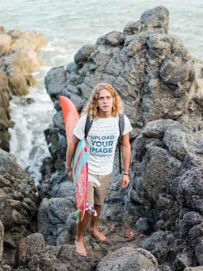 Surfer Dude Wearing a T-Shirt Mockup on the Rocks
