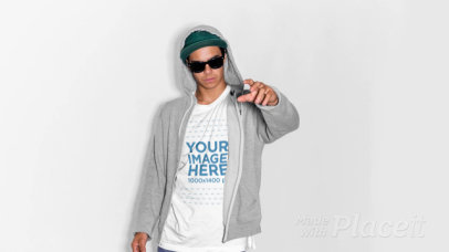 Guy Wearing a Hoodie with a T-Shirt Stop Motion and Sunglasses Pointing Away