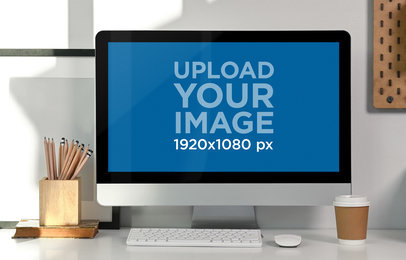 Mockup of an iMac Placed on a Desk with Pencils and a Coffee Cup M19750-r-el2