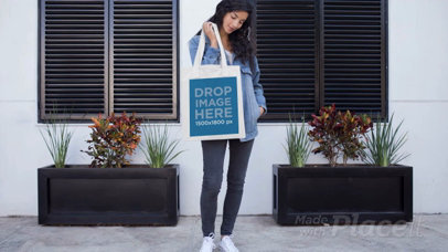 Pretty Girl Holding a Tote Bag Outside Her House in Stop Motion a13645