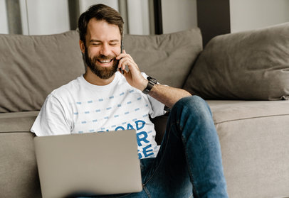 T-Shirt Mockup Featuring a Man Laughing While Talking on the Phone
