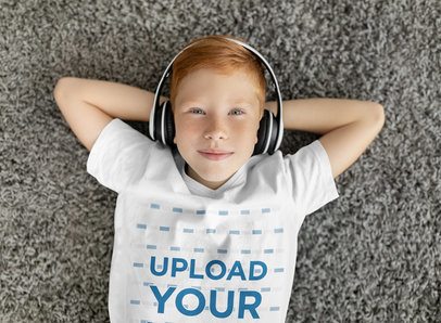 V-Neck T-Shirt Mockup of a Boy with Headphones Lying on the Floor