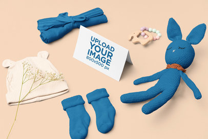 Mockup of a Greeting Card Placed Near a Stuffed Bunny m26988