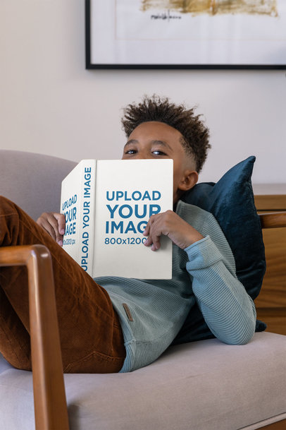 Mockup of a Boy Chilling with a Book at Home
