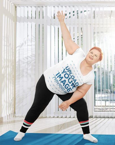 Mockup of a Happy Woman Doing Exercise in a Plus Size T-Shirt