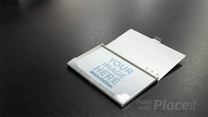 Stop Motion of a Business Card in a Card Holder on a Black Surface