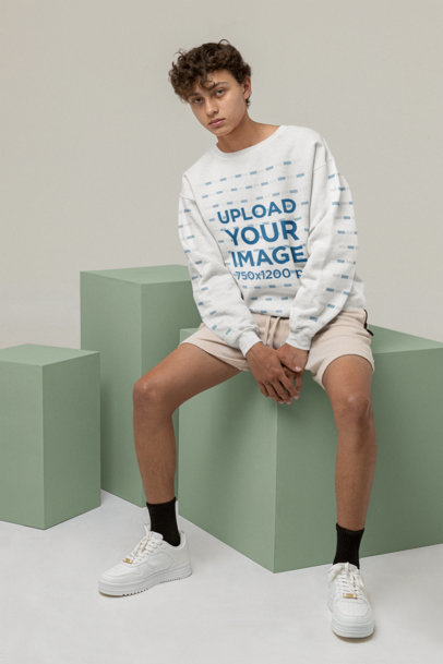 Mockup of a Young Man Wearing a Sweatshirt With Customizable Sleeves