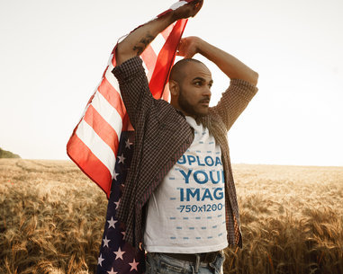 Mockup of a Bearded Man Holding an American Flag Outdoors