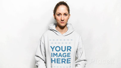 Blonde Girl Wearing a Hoodie in Stop Motion Against a White Background a13308