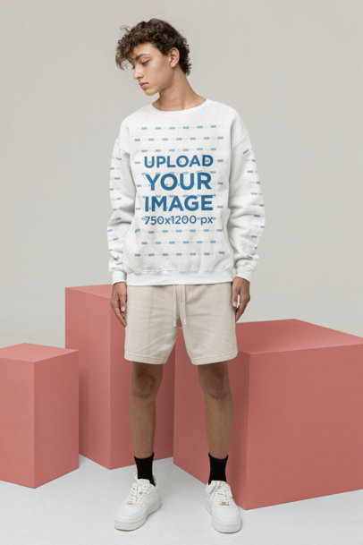 Sweatshirt Mockup Featuring a Man Looking Sideways at a Studio