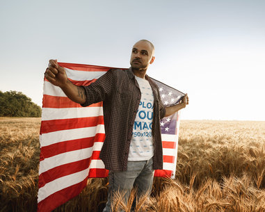 T-Shirt Mockup Featuring a Man Holding the American Flag in His Back