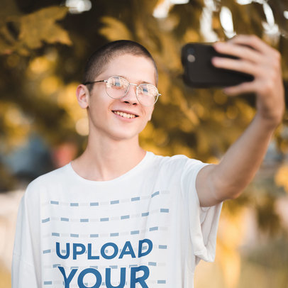 T-Shirt Mockup of a Happy Man with Glasses Taking a Selfie m13918-r-el2
