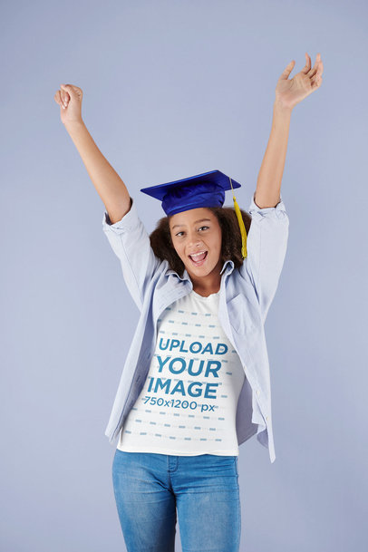 T-Shirt Mockup of a Young Curly-Haired Woman with a Graduation Cap Celebrating