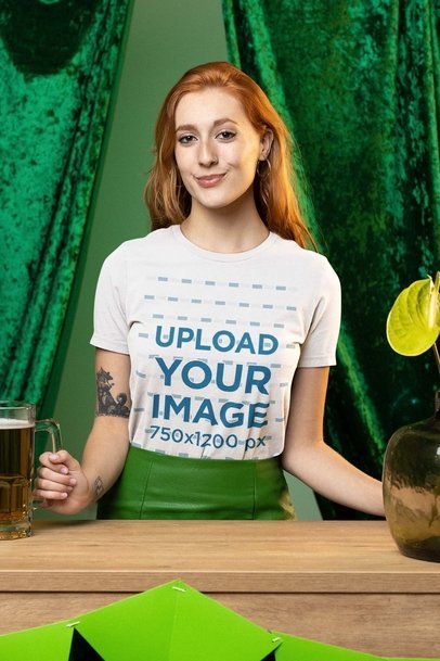 St Patrick's Day-Themed Mockup of a Tattooed Woman in a Bella Canvas Tee Holding a Beer Jar 