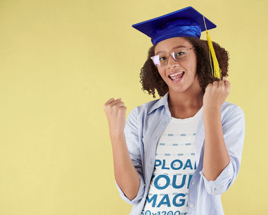 T-Shirt Mockup of a Young Woman Celebrating Her Graduation in a Studio