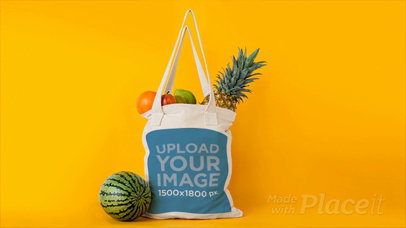 Tote Bag with Fruits Disappearing From It in Stop Motion Against Yellow Background a13711