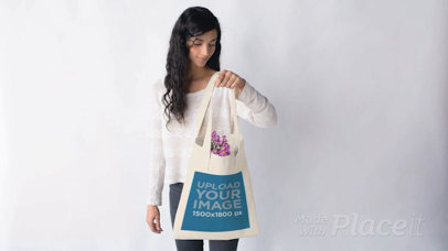 Young Pretty Girl with a Tote Bag Stop Motion Filled with Purple Flowers a13670