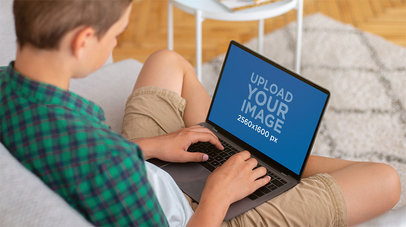 Mockup of a Teenage Boy Using a MacBook