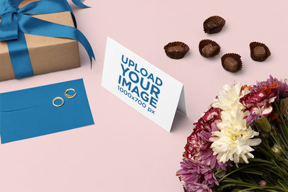 Mockup of an Open Horizontal Greeting Card Featuring Some Chocolates