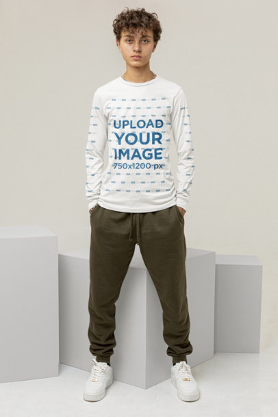 Long-Sleeve Tee Mockup of a Serious Man Standing Behind Some Cubes and Looking at the Camera