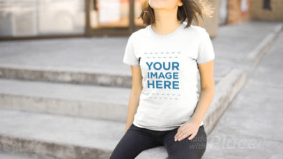 Young Woman Wearing a T-Shirt and a Beanie Video Outdoors