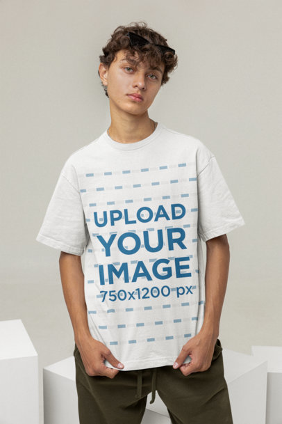 Mockup of a Young Man With Curly Hair Showcasing His T-Shirt