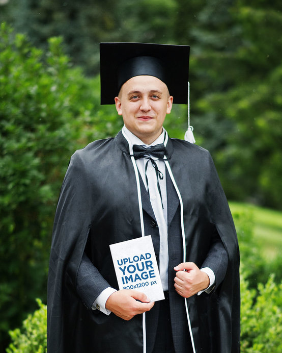 Book Mockup Featuring a Man Graduating From College