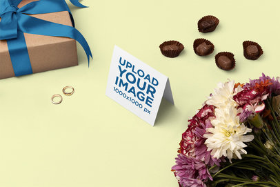 Greeting Card Mockup Featuring Some Flowers and Chocolates m26996