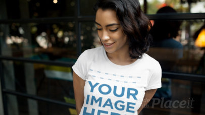 Short Haired Woman Wearing a T-Shirt Stop Motion Outside Against a Window