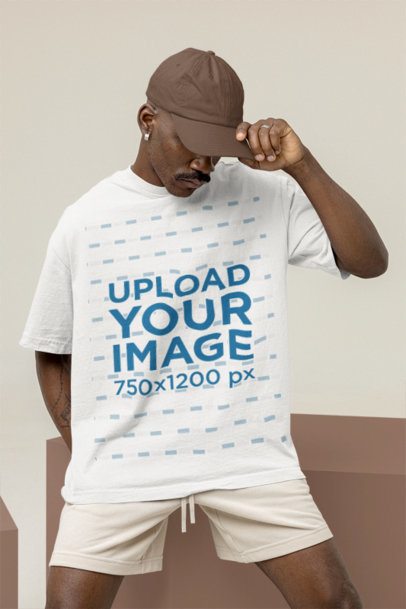 Mockup of a Man Wearing a Wide T-Shirt at a Studio