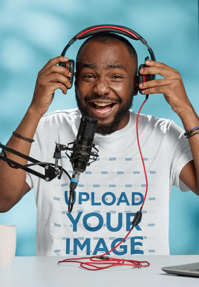 T-Shirt Mockup of a Happy Man Testing His Headphone for a Podcast Show m25901 r-el2