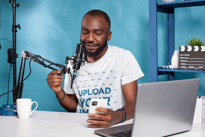 T-Shirt Mockup Featuring a Man Hosting a Podcast m25899-r-el2
