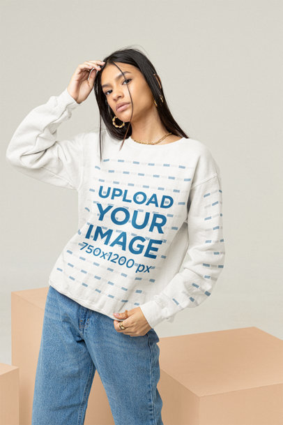Sweatshirt Mockup of a Cool Woman Posing with Cubes Behind Her