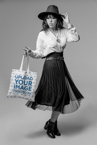 Tote Bag Mockup of a Cool Woman Posing Featuring a Black and White Theme