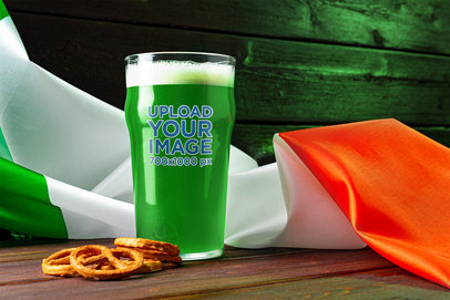 Beer Glass Mockup Featuring Pretzel Snacks and an Irish Flag