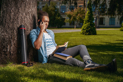 T-Shirt Mockup of an Architecture Student Sitting on the Grass m15369-r-el2