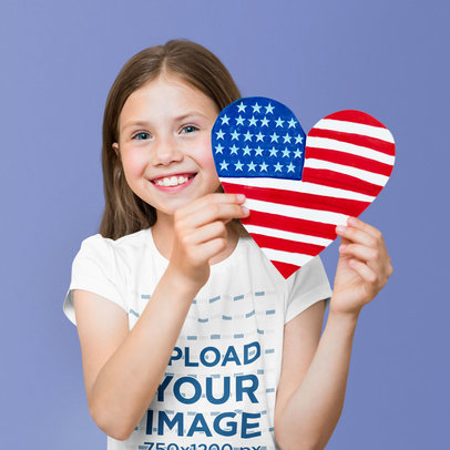 T-Shirt Mockup Featuring a Happy Girl Holding a Heart of the American Flag m26008-r-el2