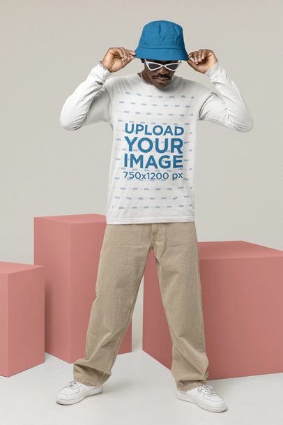 Mockup of a Man Wearing a Customizable Long Sleeve Tee and a Beanie at a Studio